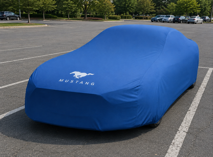 Ford Mustang with a blue custom-fit stretch car cover showing a tailored vehicle-specific fit